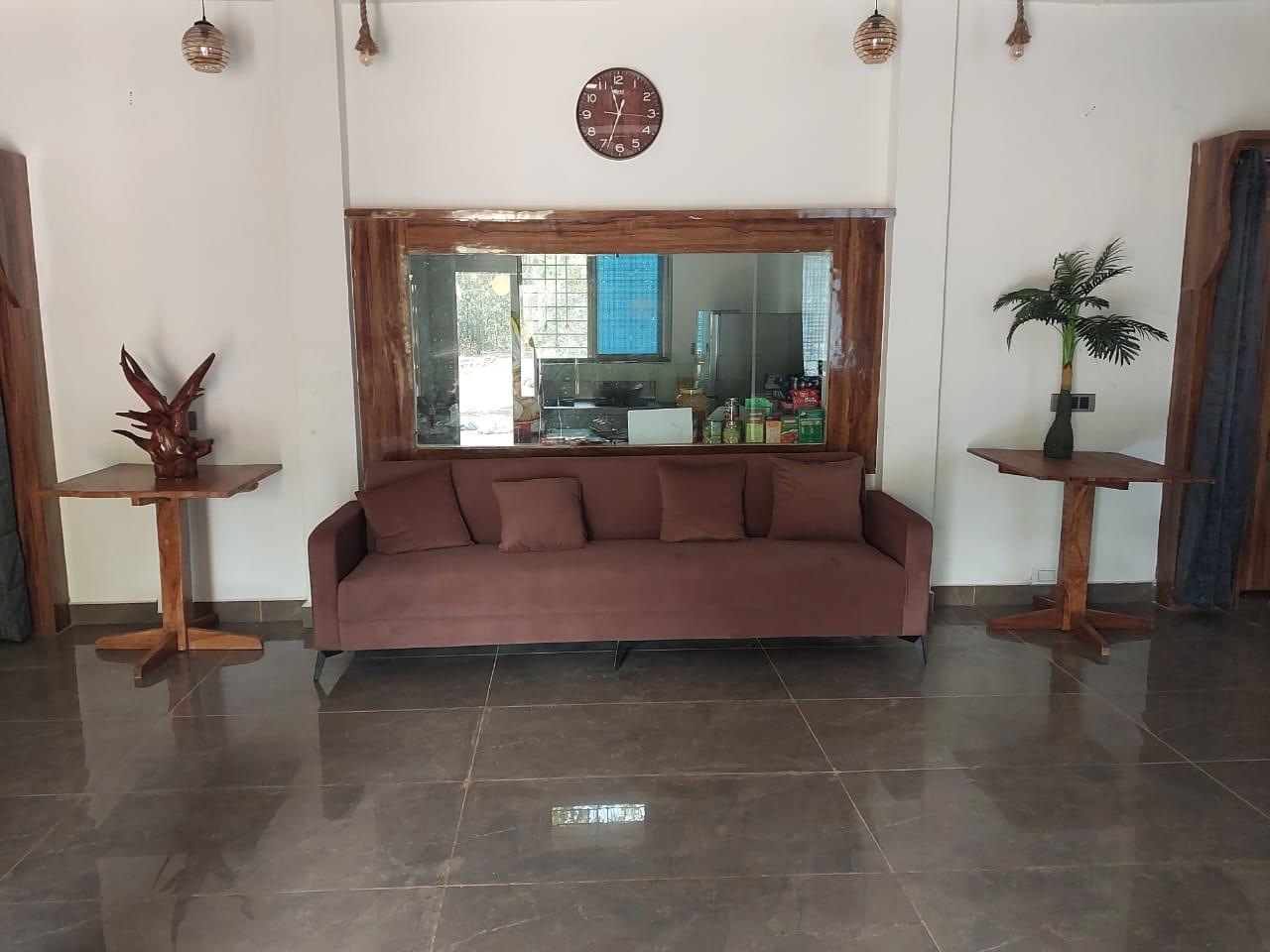 Luxury resort pool with palm trees at sunset